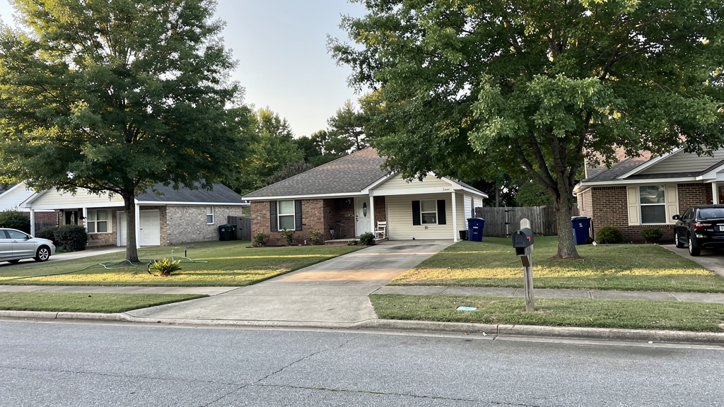 Residential street and lived-in home setting in Phenix City, Alabama